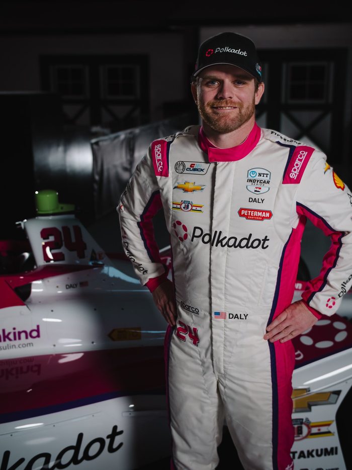 Conor Daly in the Polkadot firesuit beside the No. 24 car