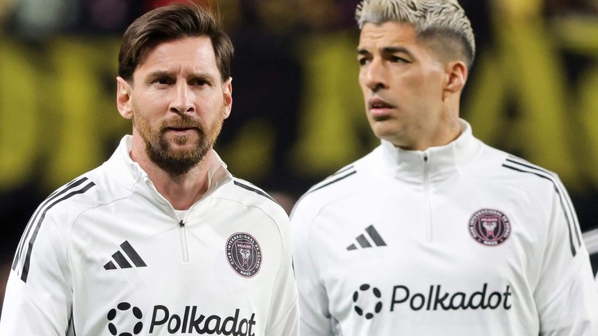 Two Inter Miami CF players in Polkadot training tops before a match