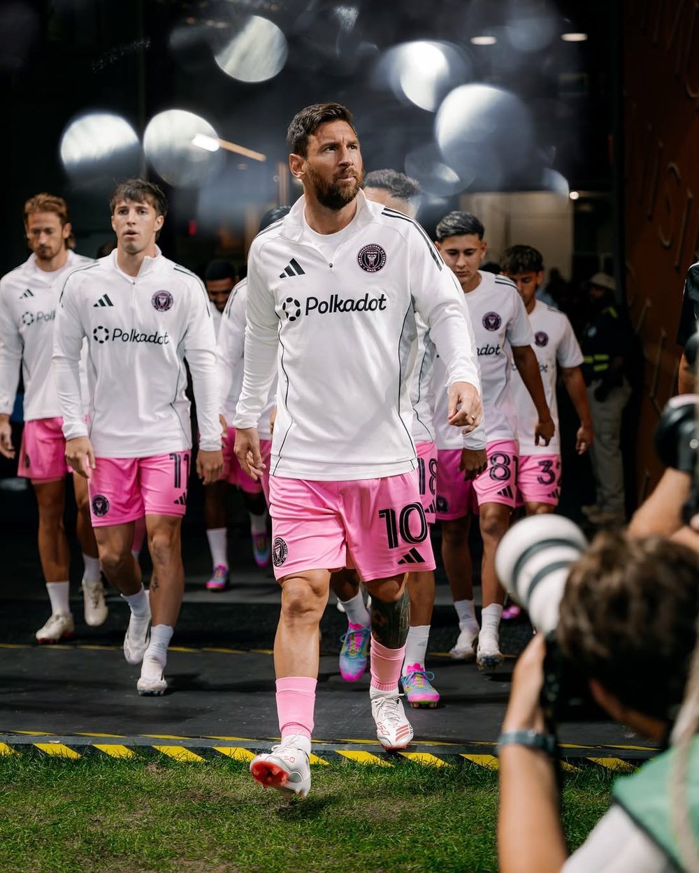 Inter Miami CF players walking out in Polkadot-branded training tops